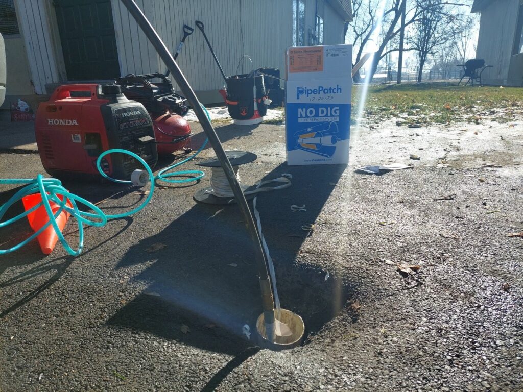 Pelican Underground Llc repairs a sewer pipe under a driveway using trenchless technology without digging up the surface.