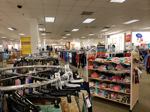 Pelican Underground Llc shows organized clothes and signs for sales, making shopping feel simple and exciting for everyone.