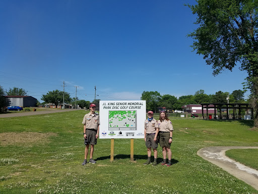 Three scouts with Pelican Underground Llc visit a golf course in a community known for trenchless pipe repair innovation.