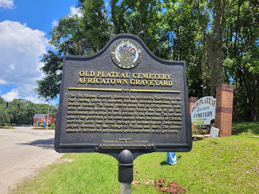 A sign shows the history of Old Plateau Cemetery, relating to how Pelican Underground Llc helps protect important systems today.