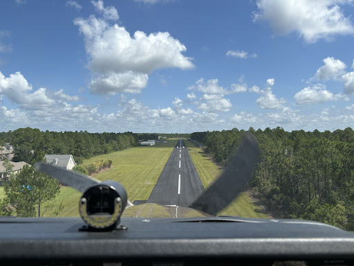 Like Pelican Underground LLC checking pipes, the pilot carefully prepares to land, paying close attention to every detail.