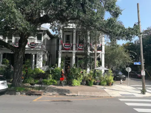 Pelican Underground LLC made home pipe repairs using trenchless tech at a house on a shady, plant-filled street corner.