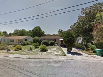 A home with a driveway shows an ideal spot Pelican Underground Llc could help if pipes ever need trenchless repair.