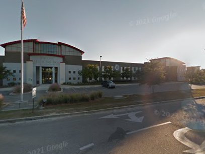 Pelican Underground Llc finished trenchless sewer repairs at a local building, marked by a flag and easy parking.