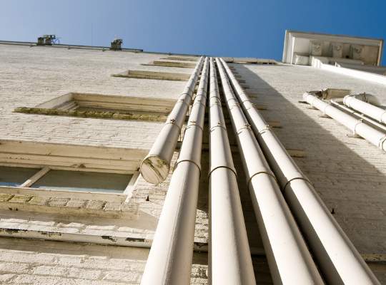 Pelican Underground LLC can help repair vertical pipes that run up the side of buildings for better safety and reliability.